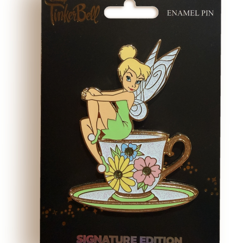 Tinker Bell Teacup enamel pin by Denyse Klette on its black Signature Edition backer card